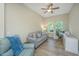 Inviting living room is enhanced by natural light, a ceiling fan, and a calming color palette at 1623 Adventure Xing # 109, Mount Pleasant, SC 29466