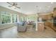 Bright living room features hardwood floors, large windows, and modern furniture at 1623 Adventure Xing # 109, Mount Pleasant, SC 29466