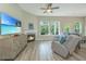 Comfortable living room with a fireplace and large TV offers a relaxing space at 1623 Adventure Xing # 109, Mount Pleasant, SC 29466