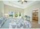 Serene main bedroom with tray ceiling, abundant natural light, and ensuite bathroom access at 1623 Adventure Xing # 109, Mount Pleasant, SC 29466