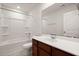 Bathroom features a white toilet, tub, dark wood vanity with a white sink and grey flooring at 169 Longford Dr, Summerville, SC 29483