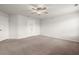 A spacious bedroom features neutral carpeting, white walls, a ceiling fan, and two closets at 169 Longford Dr, Summerville, SC 29483