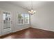 Sunlit dining area with stylish light fixture and access to the outdoors at 169 Longford Dr, Summerville, SC 29483