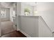 Hallway with carpet, hardwood floors, neutral paint, and natural light at 169 Longford Dr, Summerville, SC 29483