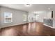 Open-concept living area featuring hardwood floors and a view of the kitchen at 169 Longford Dr, Summerville, SC 29483