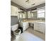 Unique bathroom with striped wallpaper and a toilet with a cat design at 1805 Wood Duck Rd, Moncks Corner, SC 29461