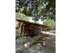 Exterior of the home featuring a large carport with tools and ample room for parking at 1805 Wood Duck Rd, Moncks Corner, SC 29461