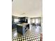 Open concept kitchen with a large island and a checkered floor at 1805 Wood Duck Rd, Moncks Corner, SC 29461