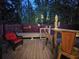 Enjoy the nighttime in this backyard patio with decorative lights and floral themed decorations at 1954 Treebark Dr, Charleston, SC 29414