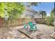 Private fenced-in backyard featuring comfortable seating and a fire pit. Surrounded by lush trees at 1954 Treebark Dr, Charleston, SC 29414