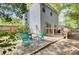 Landscaped backyard featuring a spacious deck, Adirondack chairs, and decorative stone at 1954 Treebark Dr, Charleston, SC 29414