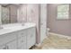 Bright bathroom featuring double sinks, a window and a nice paint job at 1954 Treebark Dr, Charleston, SC 29414
