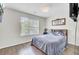 Bedroom features dark wood flooring and a cozy bed at 1954 Treebark Dr, Charleston, SC 29414