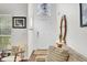 Bright foyer with hardwood floors, a stylish mirror, and a view of the front door and stairway at 1954 Treebark Dr, Charleston, SC 29414