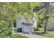 Charming two-story home featuring a combination of brick and siding, attached garage, and mature trees at 1954 Treebark Dr, Charleston, SC 29414