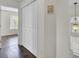 Hallway closet doors with hanging pendant lights and views to the outside at 1954 Treebark Dr, Charleston, SC 29414