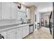 Bright kitchen featuring white cabinetry, stainless steel appliances, tile floors and lots of light at 1954 Treebark Dr, Charleston, SC 29414