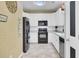 Bright kitchen featuring white cabinetry, stainless steel appliances, and a tile floor at 1954 Treebark Dr, Charleston, SC 29414