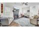 Cozy living room featuring a fireplace with mounted television, lots of light, and neutral colored walls at 1954 Treebark Dr, Charleston, SC 29414