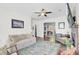 Spacious living room with hardwood floors, comfortable seating, and a view of the adjacent dining area at 1954 Treebark Dr, Charleston, SC 29414