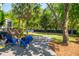 Landscaped backyard with a patio and outdoor chairs creating a welcoming space at 1977 Pierce St, Charleston, SC 29492