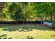 Backyard featuring a well-manicured lawn and a black wooden privacy fence at 1977 Pierce St, Charleston, SC 29492
