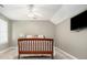 A cozy bedroom featuring soft gray walls, a ceiling fan, and a television for relaxation at 1977 Pierce St, Charleston, SC 29492
