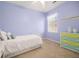 This cozy bedroom features a large window and unique color scheme at 1977 Pierce St, Charleston, SC 29492