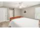 A bright bedroom featuring neutral walls, a fan, carpet flooring, and a comfortable bed at 1977 Pierce St, Charleston, SC 29492