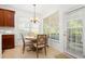 Cozy breakfast nook with a chandelier and natural light from a door and several windows at 1977 Pierce St, Charleston, SC 29492