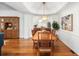 Open dining room showcasing hardwood floors, a chandelier, and a view into an adjacent area at 1977 Pierce St, Charleston, SC 29492