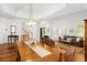 Bright dining room with an open concept, featuring hardwood floors and access to the living area at 1977 Pierce St, Charleston, SC 29492
