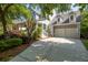 Exterior view of a well-maintained home featuring an attached two-car garage and inviting architecture at 1977 Pierce St, Charleston, SC 29492