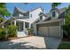 Charming home exterior highlighting an attached garage, complemented by a well-kept driveway at 1977 Pierce St, Charleston, SC 29492