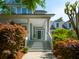 Inviting front exterior featuring a covered porch, landscaped garden, and stylish curb appeal at 1977 Pierce St, Charleston, SC 29492
