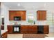Well-equipped kitchen with dark cabinetry and stainless steel microwave and dishwasher at 1977 Pierce St, Charleston, SC 29492