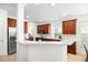 Open kitchen featuring stainless steel appliances, white countertops, and rich wood cabinetry at 1977 Pierce St, Charleston, SC 29492