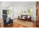 Inviting living room featuring hardwood floors, with comfortable seating and access to the front door at 1977 Pierce St, Charleston, SC 29492