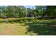 Beautiful view of a pond on a spacious lot, surrounded by lush trees and landscaping at 1977 Pierce St, Charleston, SC 29492
