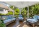 Covered porch with comfortable seating, perfect for relaxing and enjoying the outdoors at 1977 Pierce St, Charleston, SC 29492
