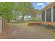 Private backyard features a wooden deck, a screened-in porch, and a storage shed at 2042 Dogwood Rd, Charleston, SC 29414