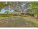 Spacious fenced backyard with a large deck and screened-in porch, perfect for outdoor entertaining at 2042 Dogwood Rd, Charleston, SC 29414