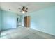 Spacious bedroom with ensuite, carpet, and ceiling fan at 2042 Dogwood Rd, Charleston, SC 29414