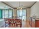 Charming dining room featuring hardwood floors, a chandelier, and an open layout for gatherings at 2042 Dogwood Rd, Charleston, SC 29414