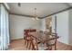 Elegant dining room featuring a wooden table and chairs set beneath a decorative chandelier at 2042 Dogwood Rd, Charleston, SC 29414
