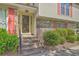 Inviting entrance with brick steps leading to the front door and manicured landscaping at 2042 Dogwood Rd, Charleston, SC 29414