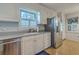 Bright kitchen with stainless appliances, white cabinetry, and a window view at 2042 Dogwood Rd, Charleston, SC 29414