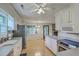 Open kitchen features a stainless steel refrigerator and oven with an adjacent dining area at 2042 Dogwood Rd, Charleston, SC 29414