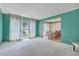 Spacious living room with large windows and an open view into the dining area at 2042 Dogwood Rd, Charleston, SC 29414