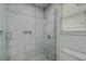 Clean, bright shower with white tiles, glass enclosure, and modern fixtures at 2042 Dogwood Rd, Charleston, SC 29414